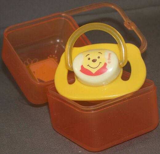 Yellow winnie pooh Pacifier with container