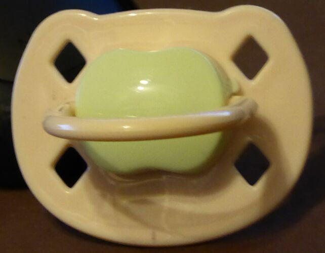 Cream, and Light-green Spanish style dummy with Nuk teat